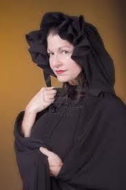 The Enigma of the Woman in The Black Cape and Hood.