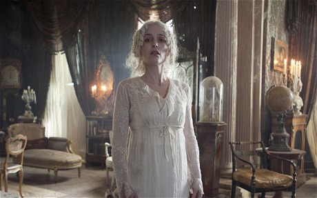 Miss Havisham - a once, beautiful and happy bride standing in a dilapidated house.