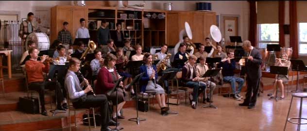 Holland conducts the Kennedy High School Band.