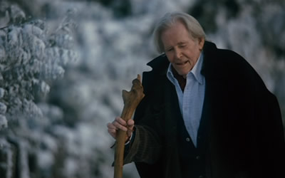 "Christmas Cottage" - Scene from the movie - Glen hobbles over to the Kinkade cottage.